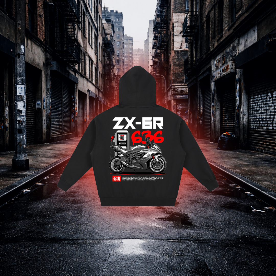 Black hoodie with motorcycle design and text on a dark alleyway background Fuel Stop Oversized Zip Hoodie – Premium Sportbike Streetwear Hoodie
