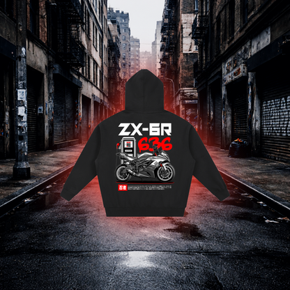 Black hoodie with motorcycle design and text on a dark alleyway background Fuel Stop Oversized Zip Hoodie – Premium Sportbike Streetwear Hoodie