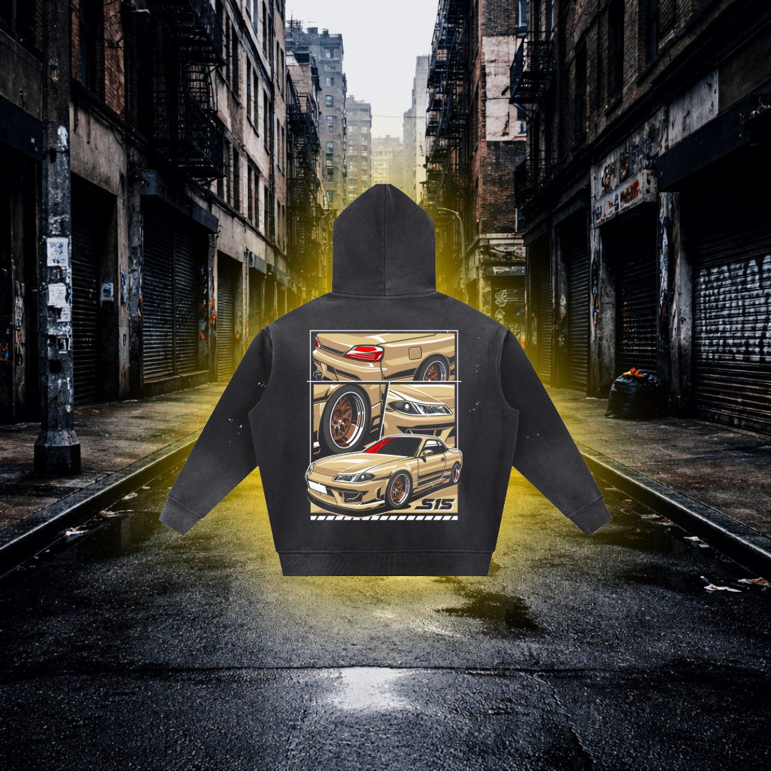 Black hoodie with car design on the back in an urban alleyway