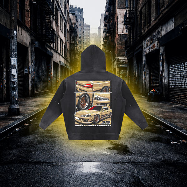 Black hoodie with car design on the back in an urban alleyway