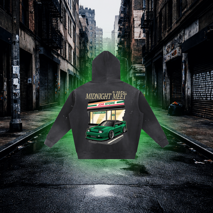 Black hoodie with car graphic and text on a city street background