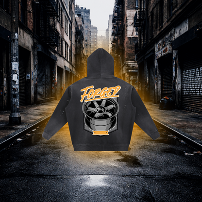 Black hoodie with 'Forged' logo on back in an urban alleyway Forged Wheels Inspired Hoodie – Premium Automotive Streetwear Hoodie