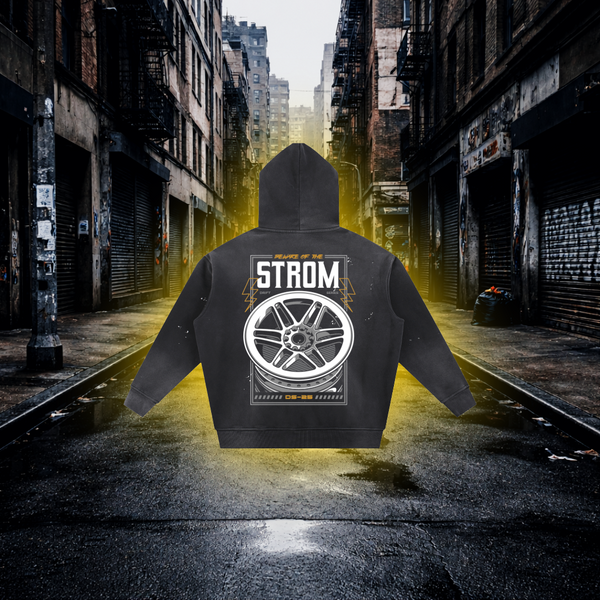 Black hoodie with 'STROM' graphic on the back in an urban alleyway. STROM Wheels Inspired Hoodie – Premium Automotive Streetwear Hoodie