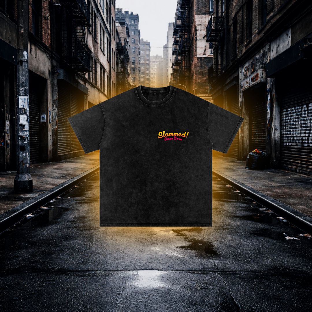 Black T-Shirt with 'Slammed! Since Born' text on the Chest on an Urban Background Slammed Since Born Bobby Car Inspired T-Shirt – Premium Stance Streetwear Tee T-Shirt