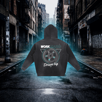 Hoodie with 'Work Hard, Dream Big' text and graphic on a city street background Work Hard Dream Big Wheels Inspired Hoodie – Premium Automotive Streetwear Hoodie