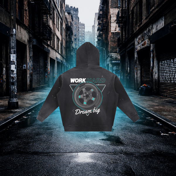 Hoodie with 'Work Hard, Dream Big' text and graphic on a city street background Work Hard Dream Big Wheels Inspired Hoodie – Premium Automotive Streetwear Hoodie