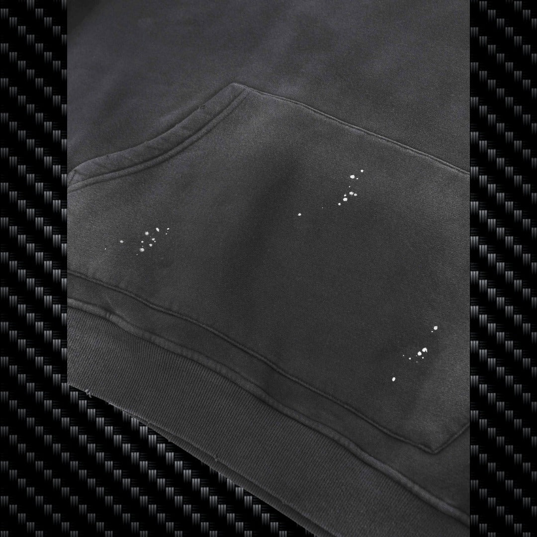 Close-up of a black hoodie with visible wear and tear on a carbon fiber pattern background Samurai Street Beast Oversized Hoodie – Power Drift Car Streetwear Hoodie