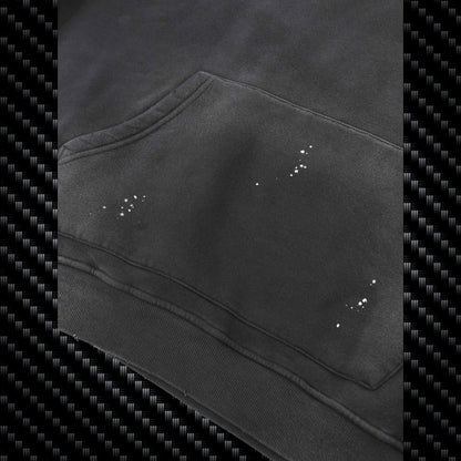 Close-up of a black hoodie with visible wear and tear on a carbon fiber pattern background Samurai Street Beast Oversized Hoodie – Power Drift Car Streetwear Hoodie