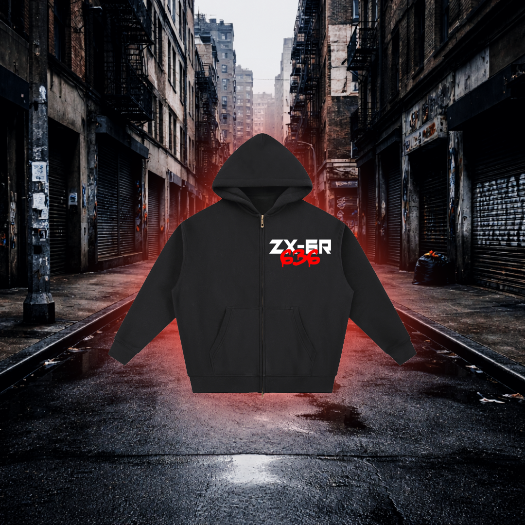 Black hoodie with red and white text on a dark alleyway background Fuel Stop Oversized Zip Hoodie – Premium Sportbike Streetwear Hoodie