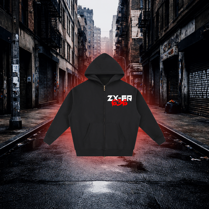 Black hoodie with red and white text on a dark alleyway background Fuel Stop Oversized Zip Hoodie – Premium Sportbike Streetwear Hoodie
