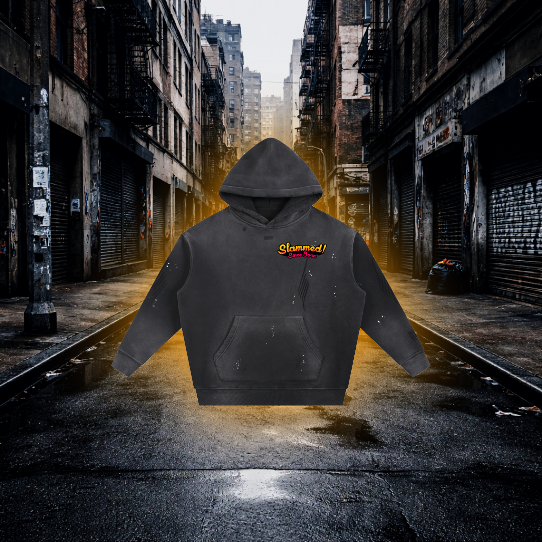 Black hoodie with 'Slammed! Since Born' text on the Chest on an Urban Background Slammed Since Born Bobby Car Inspired Hoodie – Premium Stance Streetwear Hoodie
