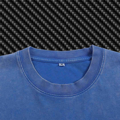 Close-up of a blue shirt collar with a carbon fiber pattern in the background